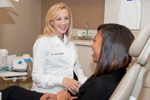 Dr. Angela Ojibway welcomes new patient at the office in Dunwoody, GA.