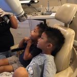 Two boys sitting at dental chair in Dunwoody, GA.