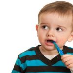 Child with a Toothbrush in His Mouth