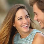 Young couple with perfect smiles.