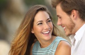 Young couple with perfect smiles.