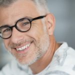smiling middle aged man with glasses