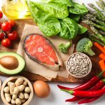 Many different healthy food on white table, flat lay
